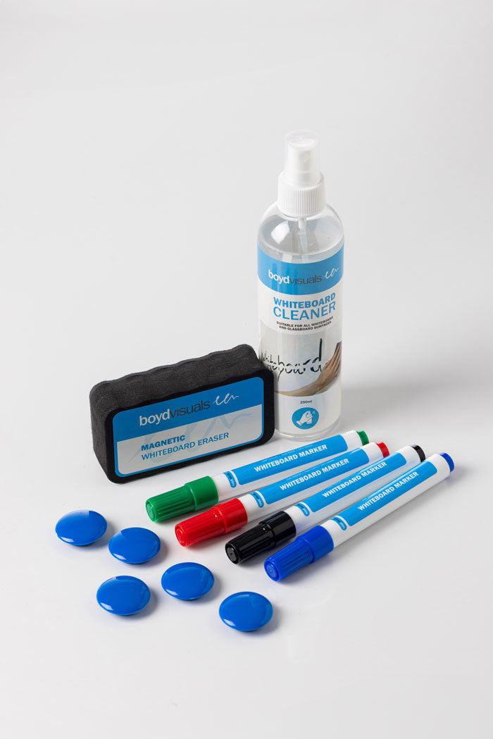 The Home Office Space NZ Whiteboard Starter Kit includes a 250ml cleaner spray bottle, an eraser, four markers in vibrant red, green, blue, and black colors, and five blue circular magnets—all elegantly set on a white background. Experience organized creativity with eco-friendly packaging.