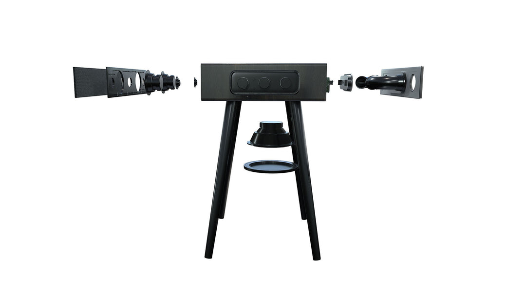 The MySound Blues Bluetooth Speaker Side-Table by Home Office Space NZ features a sleek black rectangular central unit on a tripod stand, disassembled side speakers showcasing internal elements, and wireless device charging for added convenience.