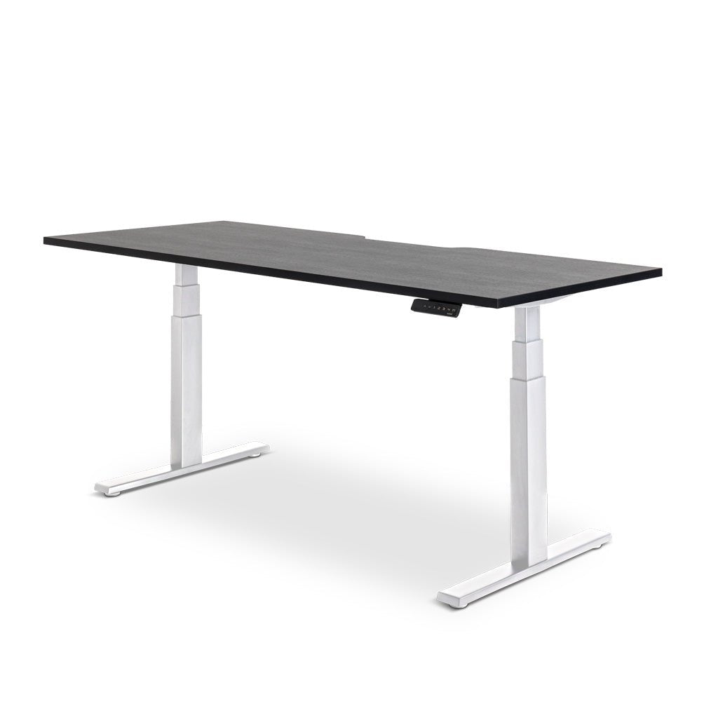Enhance electric height-adjustable desk: Modern electric standing desk with USB charging port, white frame and black top.